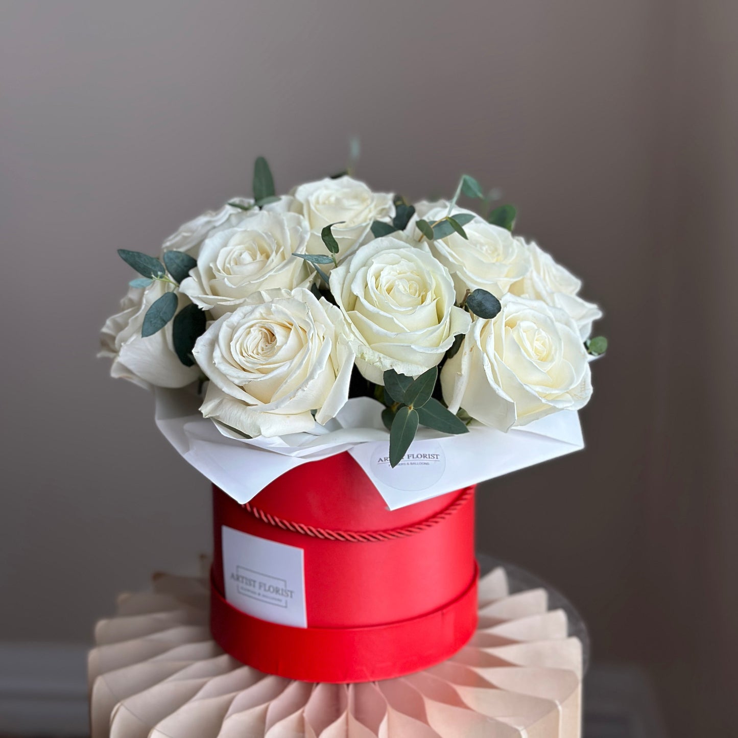 White Rose Elegance – Dozen White Roses in Red Hat Box
