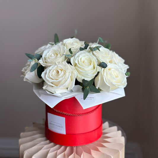 White Rose Elegance – Dozen White Roses in Red Hat Box