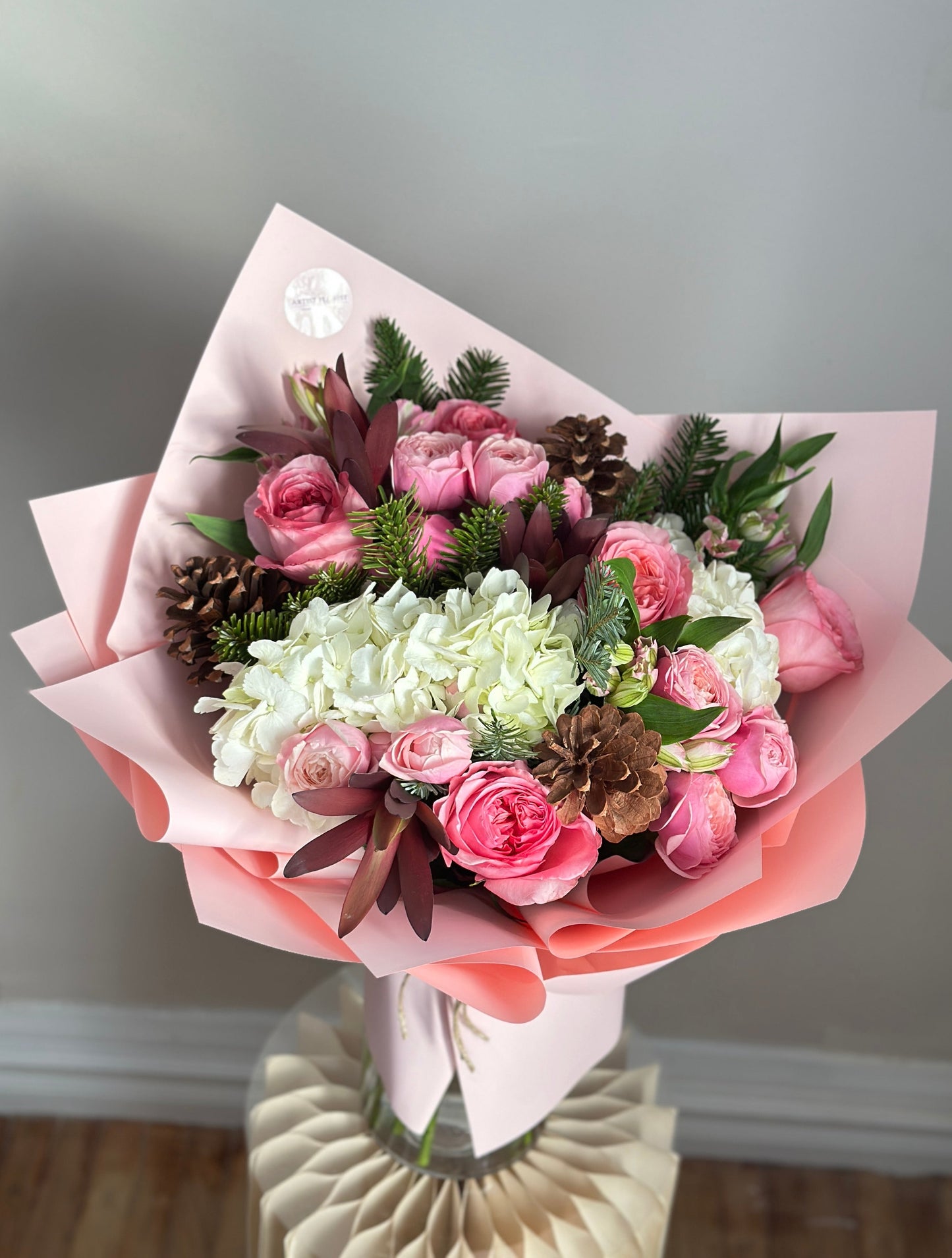 Pink Winter Whisper – Soft Pink Bouquet with Pine & Cones
