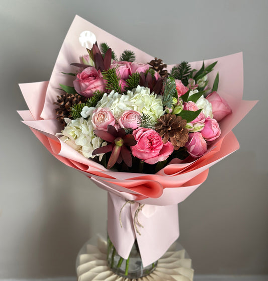 Pink Winter Whisper – Soft Pink Bouquet with Pine & Cones